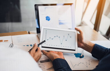 person with tablet with graph