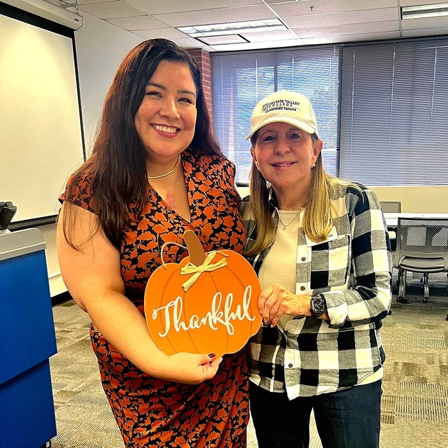 trustee rydell poses with Lizett Bobadilla, EOPS 