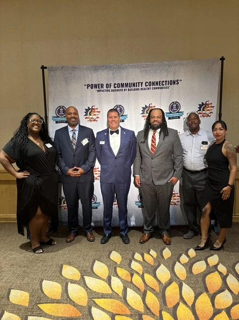 people posing at the black chamber dinner