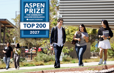 students walking on campus with Aspen prize box showing top 200
