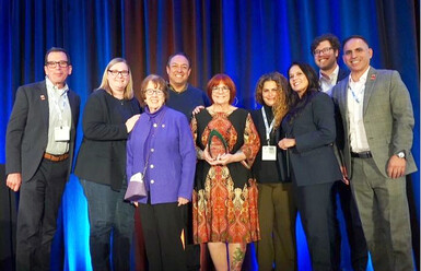 photo of socccd accepting accca award